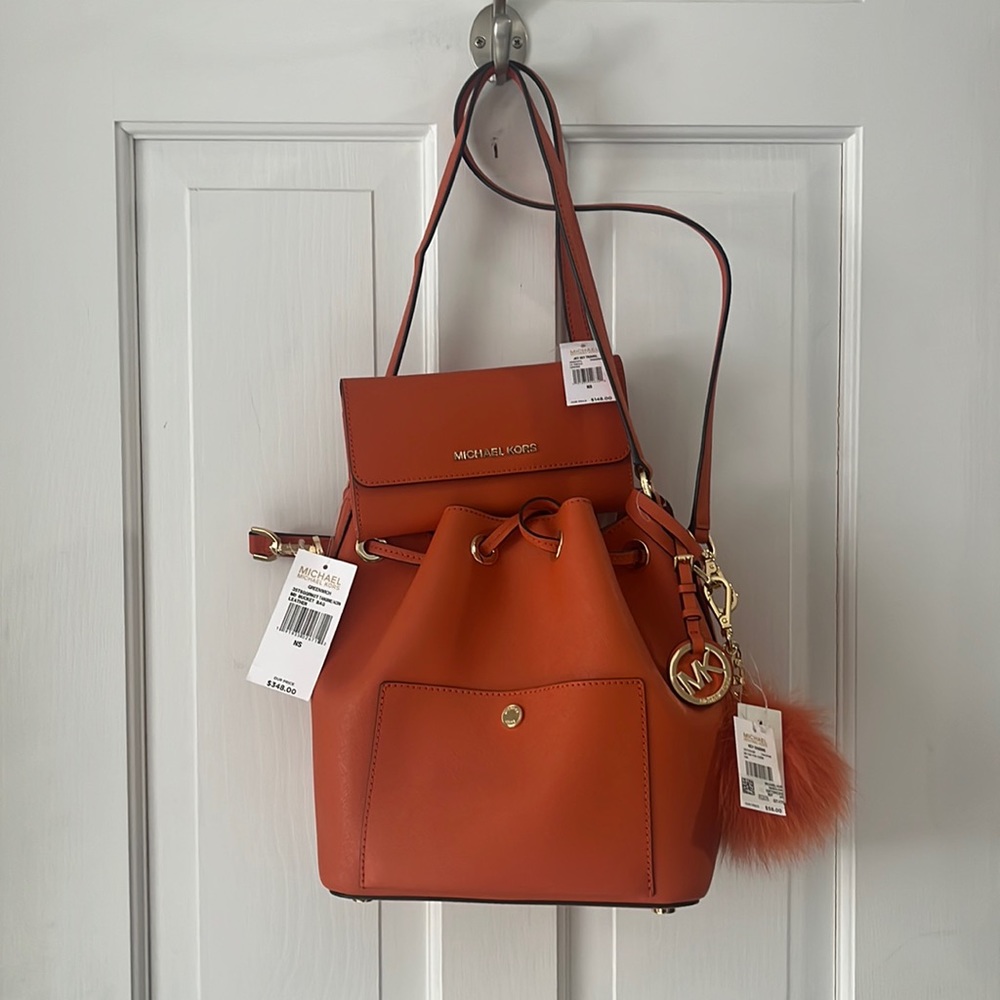 New, with tags, MICHAEL Michael Kors bucket bag, wallet, and fox fur key charm